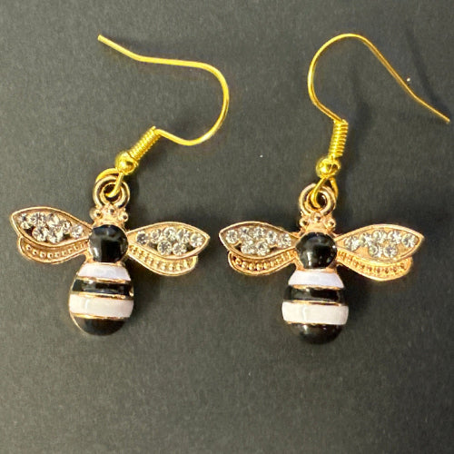 Bee-shaped earrings with gold, black, and white design 