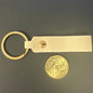 Brass keychain with leather strap and gold coin