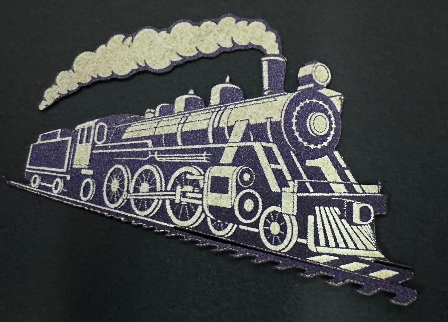 Decorative train design on a black background